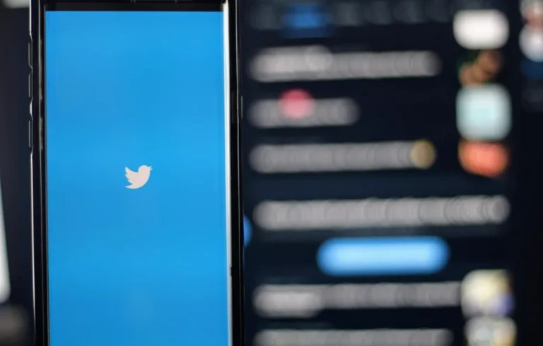 Smartphone displaying Twitter app with notifications.